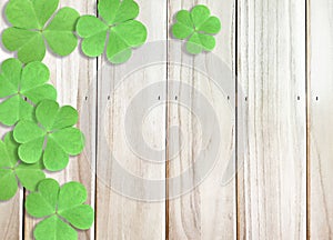 St. Patrick`s Day Background with Green Shamrocks Left top Corner on Wooden Texture