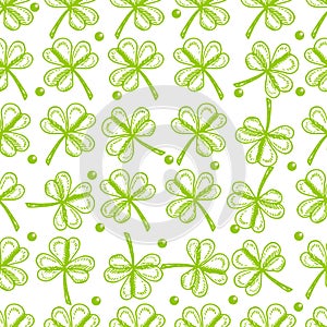 St. Patrick`s Day background. Vector seamless pattern symbols of St. Patrick` s holiday such as green shamrock leaves