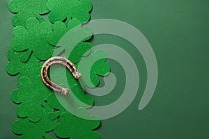 St. Patrick\'s day border with clover leaf, horseshoe on green