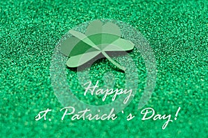 St. Patrick`s day, clover on a green shiny background