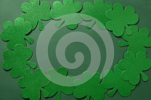 St. Patrick\'s day frame with clover leaves on green