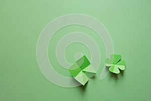 St. patrick`s day. green background with clover leave four-leafed. copy space. photo