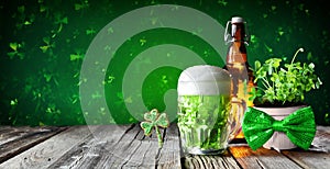St Patrick`s Day - Green Beer In Glass With Bottle And Clovers photo