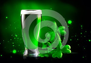 St. Patrick`s Day Green Beer pint over dark green background, decorated with shamrock leaves. Patrick Day Irish pub party