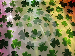 St Patrick's Day green clovers, with Rainbow reflections. ROY G BIV (red orange yellow green blue indigo purple)