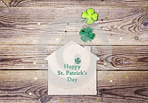 St.Patrick`s day greeting message with lucky home symbol and fou