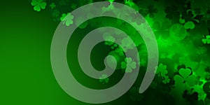 St Patrick`s day illustration, clover leafs rotating on the green background
