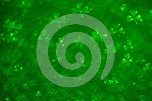 St.Patrick `s Day. Light green lights. Clover shaped bokeh. Blurred, not sharp, abstract background for design. Shamrock