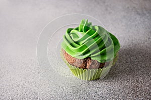 St. Patrick\'s Day tasty cupcake with green whipped cream