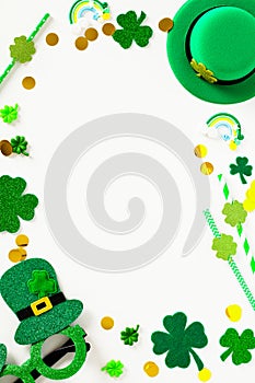 St Patrick`s Day vertical banner template. Frame made of Saint Patricks Day party decorations, leprechauns hat, glasses, shamrock