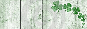 St Patricks day background. Shamrocks over a light green wood background. Decoration for St. Patrick\'s Day