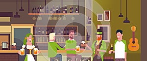 St. Patricks Day Party In Irish Pub Concept Group Of People Wearing Green Hats And Drinking Beer Together