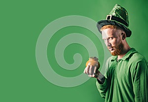 St patricks day. Patricks Day Pot of Gold and shamrocks. Red hair man in Saint Patrick's Day leprechaun party on
