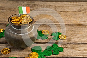St. Patricks Day pot of chocolate gold coins with irish flag and shamrocks