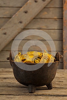 St. Patricks Day pot filled with chocolate gold coins photo