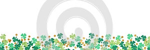 St Patricks Day shamrock and gold coin confetti banner border isolated on a white background