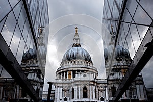 St. Paul Cathedral reflected on glass office building in London