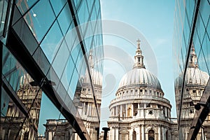 St. Paul's Cathedral church ireflected in glass walls of One New Change in London photo