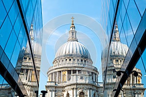 St. Paul's Cathedral church ireflected in glass walls of One New Change in London photo