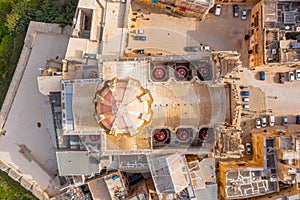 St. Paul`s Cathedral in the town of Mdina surrounded by a fortress narrow streets, aerial top view
