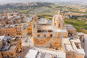 St. Paul`s Cathedral in the town of Mdina surrounded by a fortress narrow streets, aerial view