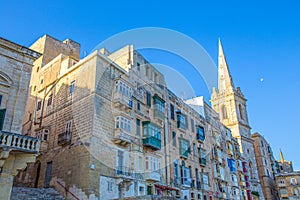 St Paul`s Pro-Cathedral at Valletta with colorful maltese balconies