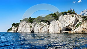 St. Peter Forest Park in Makarska seen from water.