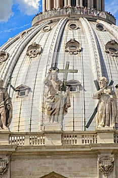 St. Peter`s Basilica Cathedral`s dome with close-up of statue of Jesus Christ
