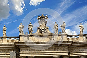 St. Peter`s Basilica Cathedral`s roof line with statues of apostles.