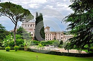 St. Peter`s Basilica dome and Vatican gardens, center of Rome, Italy