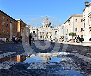 St. PeterÃ¢â¬â¢s Basilica Vatican City puddle reflection. Rome, Italy.