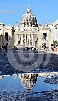 St. PeterÃ¢â¬â¢s Basilica Vatican City puddle reflection. Rome, Italy.