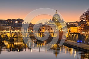 St. Peter`s Basilica in Vatican City on the Tiber River through Rome, Italy