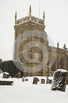 St peter`s church, Kineton, Warwickshire, UK in the snow