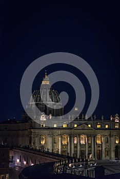 St Peter`s dome anf facade at night, Vatican city