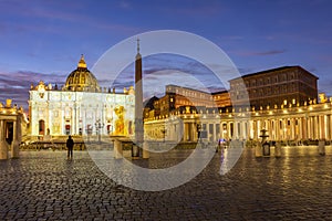 St. Peter`s square in Vatican at night, center of Rome, Italy translation