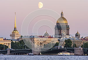 St. Petersburg cityscape with Saint Isaac`s cathedral, Admiralty building and Palace bridge at sunset, Russia