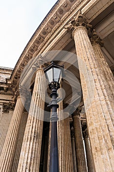 St. Petersburg, Russia, February 10, 2024. Vintage lantern against the background of the colonnade of the Kazan Cathedral.