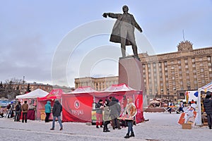Tea tents under a monument to Vladimir Lenin during the carnival