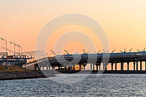 St. Petersburg, Russia, July 2018. Modern cable-stayed bridge on a background of orange sky at sunset.