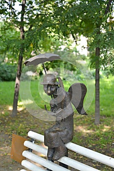 ST. PETERSBURG, RUSSIA. A sculpture The St. Petersburg angel on a bench in the Izmaylovsky garden