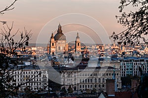 St. Stephen`s Basilica, in Budapest, against a setting sun