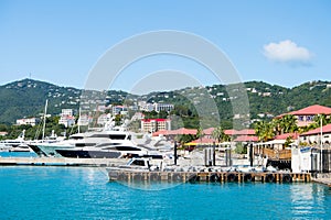 St.Thomas, British virgin island - January 13, 2016: luxury travel on boat, water transport. Yachts moored at sea pier on mountain