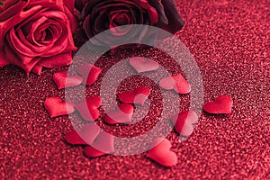 St. Valentine's Day concept. Red scarlet roses and many red hearts on red glitter background. Postcard banner on