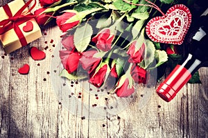 St Valentine's setting with red roses bouquet, present and red w