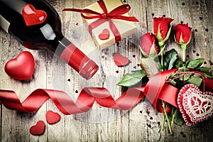 St Valentine's setting with red roses bouquet, present and red w