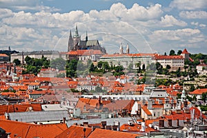 St. Vitus Cathedral over old town red roofs. Prague, Czech Republic