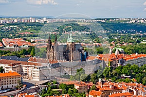 St. Vitus Cathedral over old town red roofs. Prague, Czech Republic