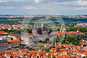 St. Vitus Cathedral over old town red roofs. Prague, Czech Republic