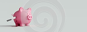 Stabbed Piggy bank with kitchen knife , business and economy concept background photo